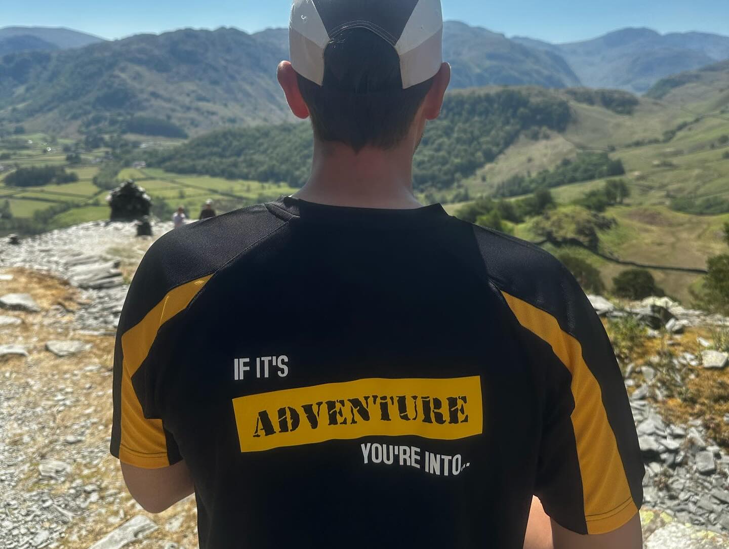 Keswick Adventures staff member facing the mountains