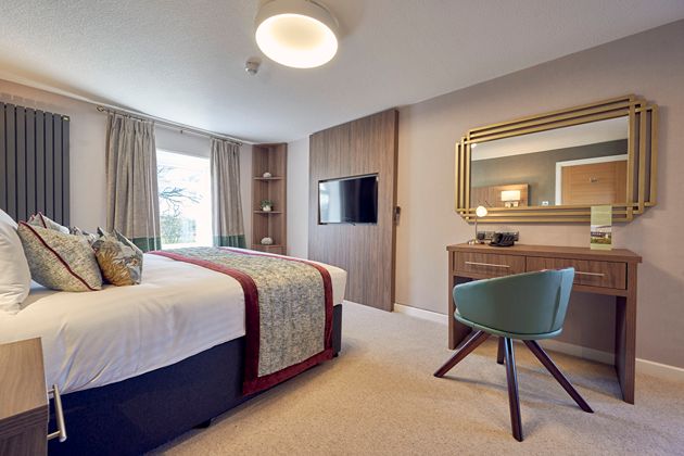 “Booked with 2 weeks to spare and it was such a good decision. We were super impressed.” - Amy The Manasses Suite hotel bedroom