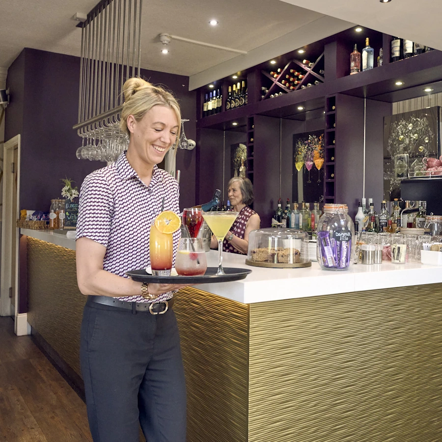 Waiting staff serving cocktails
