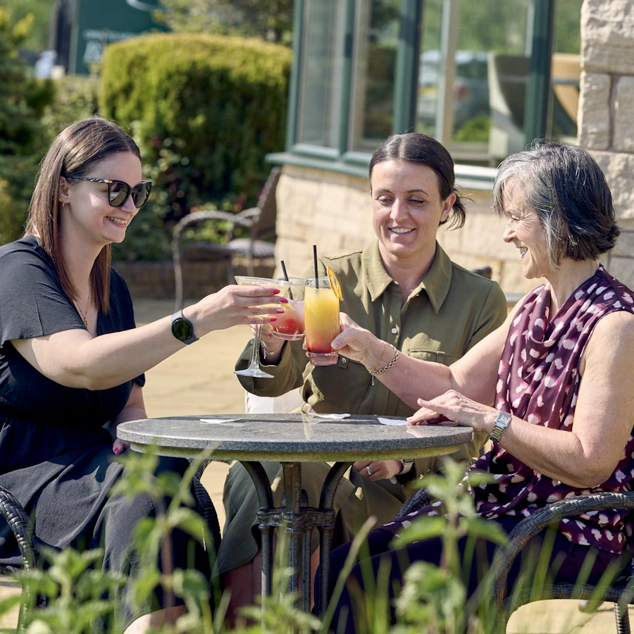 Women enjoying cocktails on the terrace