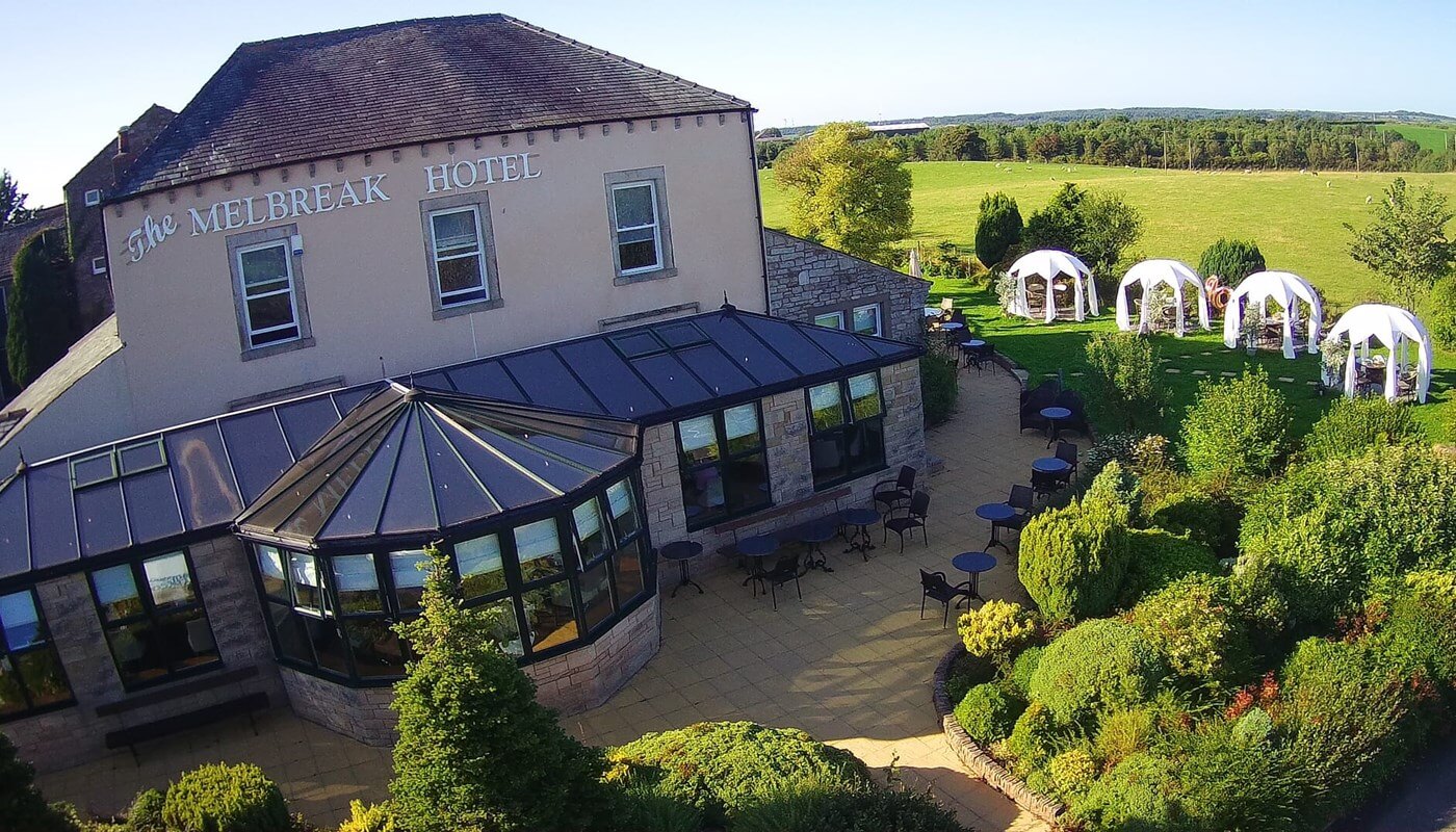 Panoramic view of the Melbreak Hotel and surrounding countryside