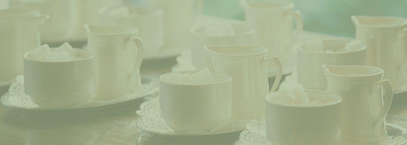 Sugar bowls and milk jugs on trays