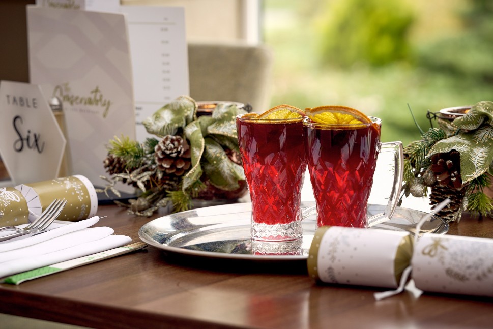 Glasses of mulled cider on a Christmas dining table